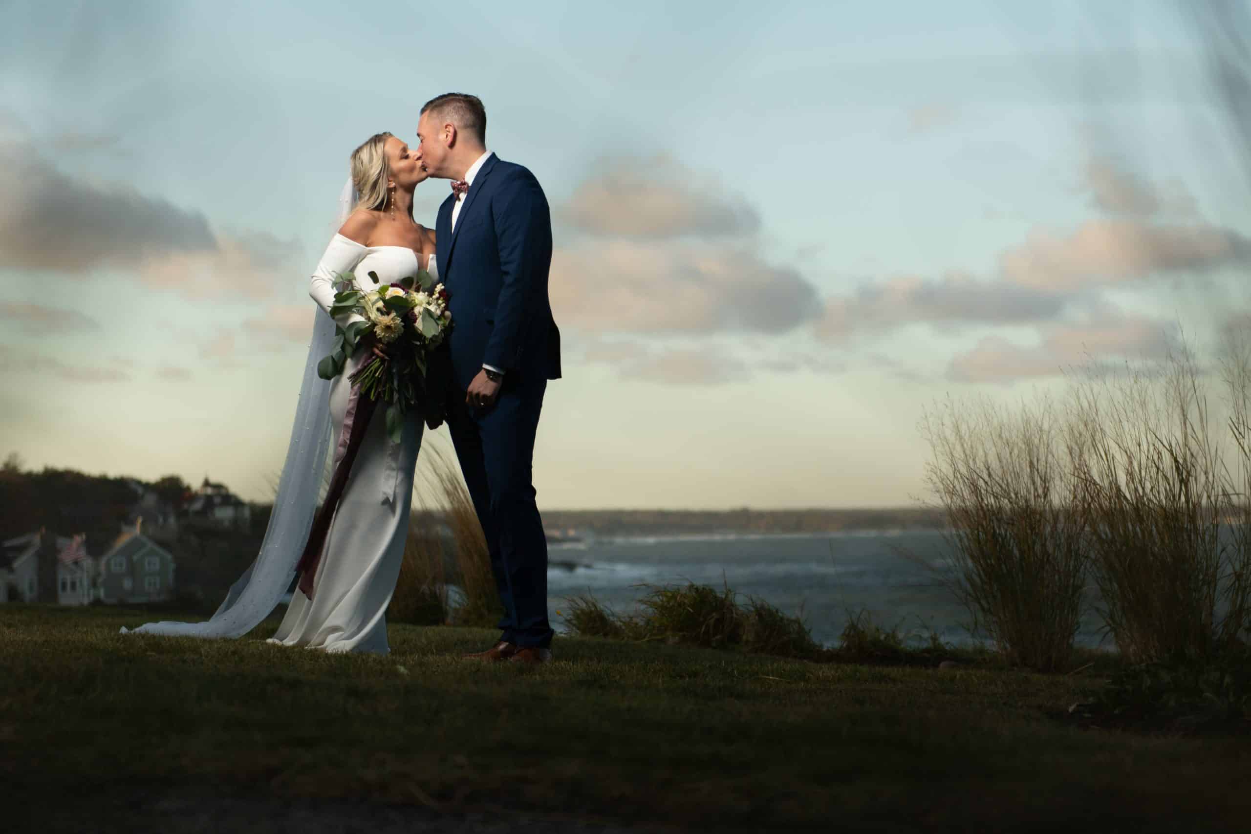 Couple at their wedding being photographed by their Wedding Photographer