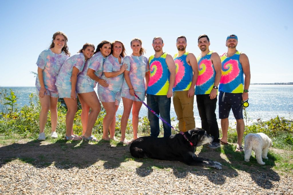 Group of bridesmaids and groomsmen together with a bride before the wedding