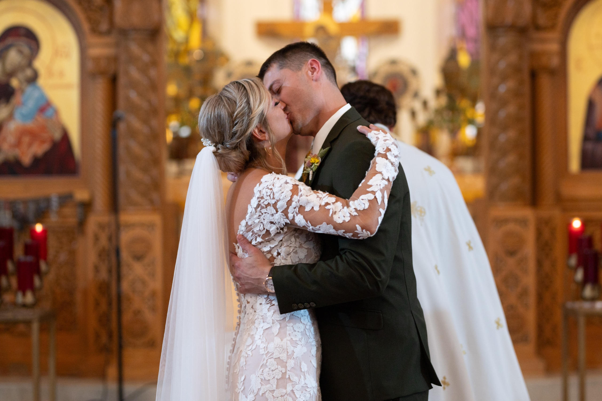 bride and groom kiss at the end of their wedding ceremony